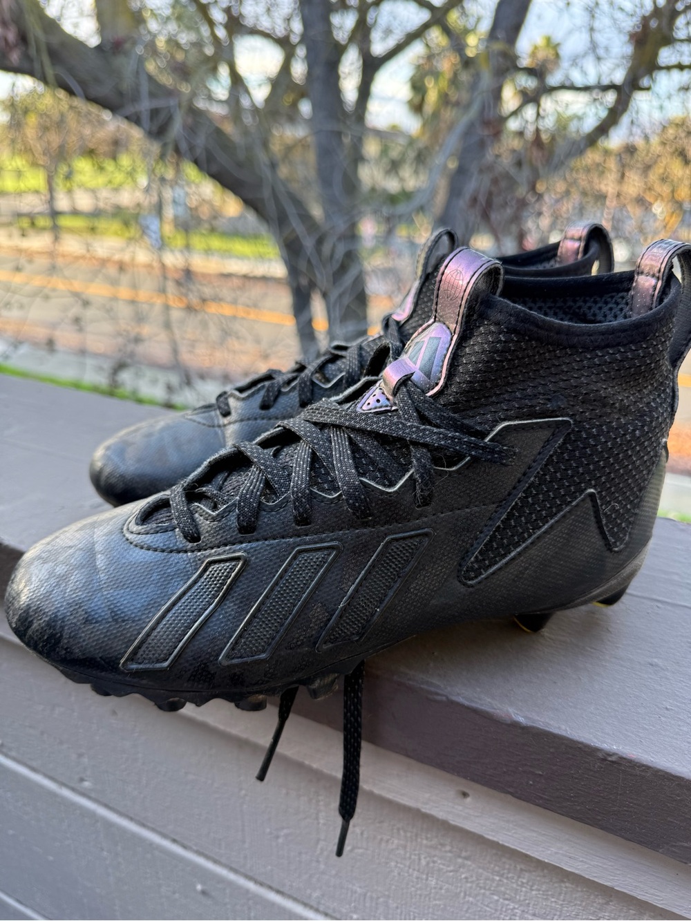 adidas Black Athletic Cleats with Iridescent Purple Pull Tabs